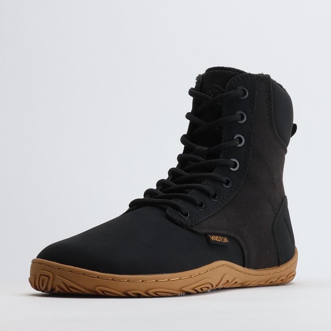 Single black barefoot winter boot shown from a front angle on a light gray background.