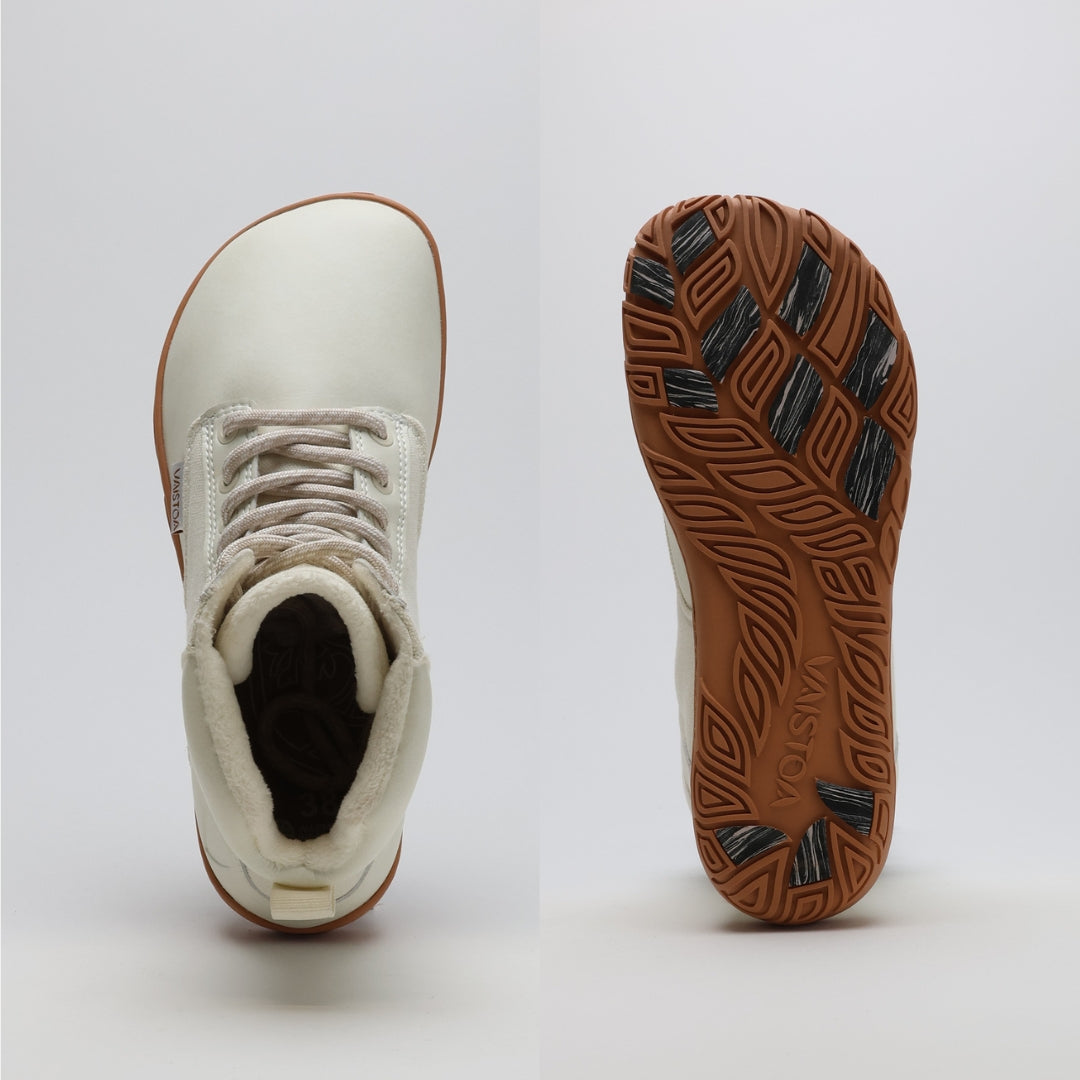 Off white barefoot winter boot showing a wide anatomical toe box on a light gray background.