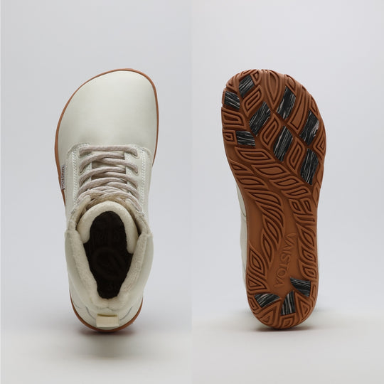 Off white barefoot winter boot showing a wide anatomical toe box on a light gray background.