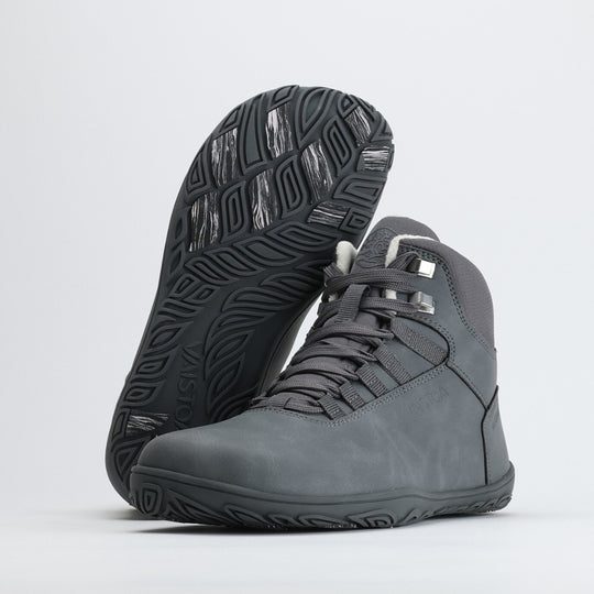 Frost gray barefoot hiking boots with the “Design from Finland” label, showcasing Nordic design that combines natural movement, waterproof protection, and winter-ready functionality.