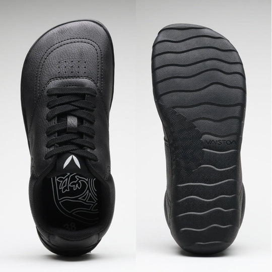Vaistoa Katu 2 black barefoot sneakers – top view showing a wide, foot-shaped toe box, and sole view showing a thin, flexible sole with a wavy pattern.