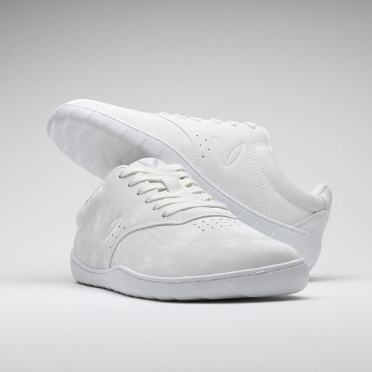 Vaistoa Katu 2 white barefoot sneakers – stylishly arranged so that one shoe rests on top of the other, emphasizing the minimalist design and sleek silhouette.