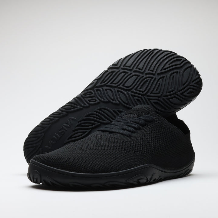 Vaistoa Iloa knitted barefoot sneakers – pair shown from the side with the rear shoe tilted up to reveal the patterned sole, against a light background