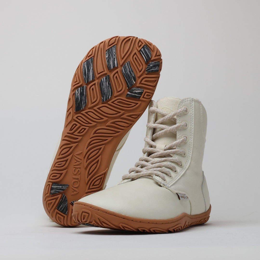 Off white barefoot winter boots with the “Design from Finland” label, showcasing minimalist Nordic design that combines warmth, lightness, and natural movement.