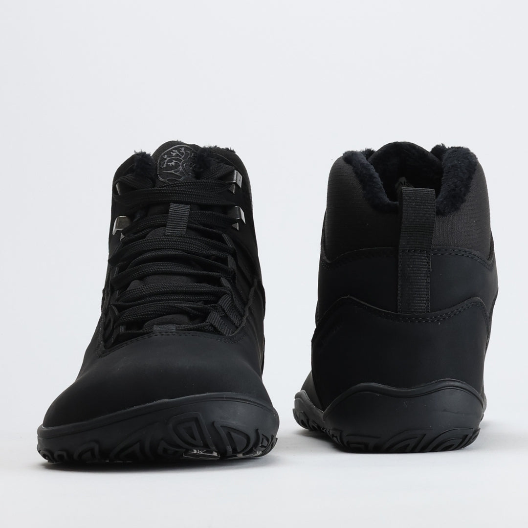 Pair of black barefoot hiking boots shown from the front and back on a light gray background.