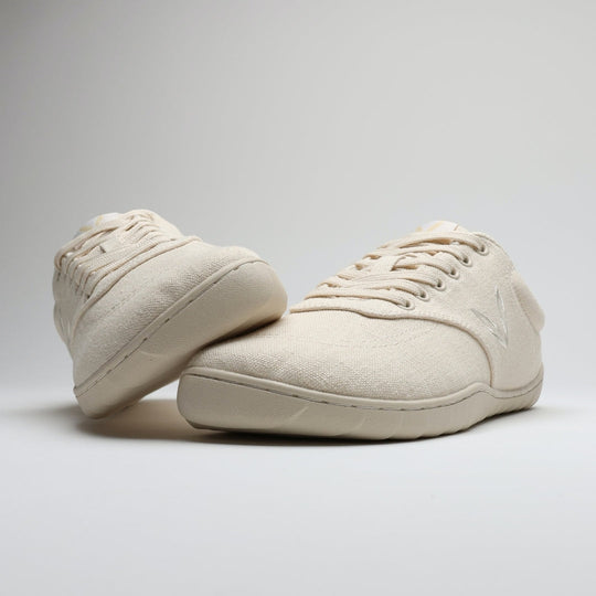 Vaistoa Huoleton barefoot hemp sneakers – natural hemp, pair with one shoe leaning on the other, side profiles and the thin sole visible, light background