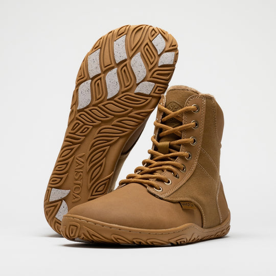 Vaistoa Hurmos 3 casual winter barefoot boots – pair with one shoe upright with the outsole and light grip pads facing the camera and the other standing in front of it at a front angle, against a light background