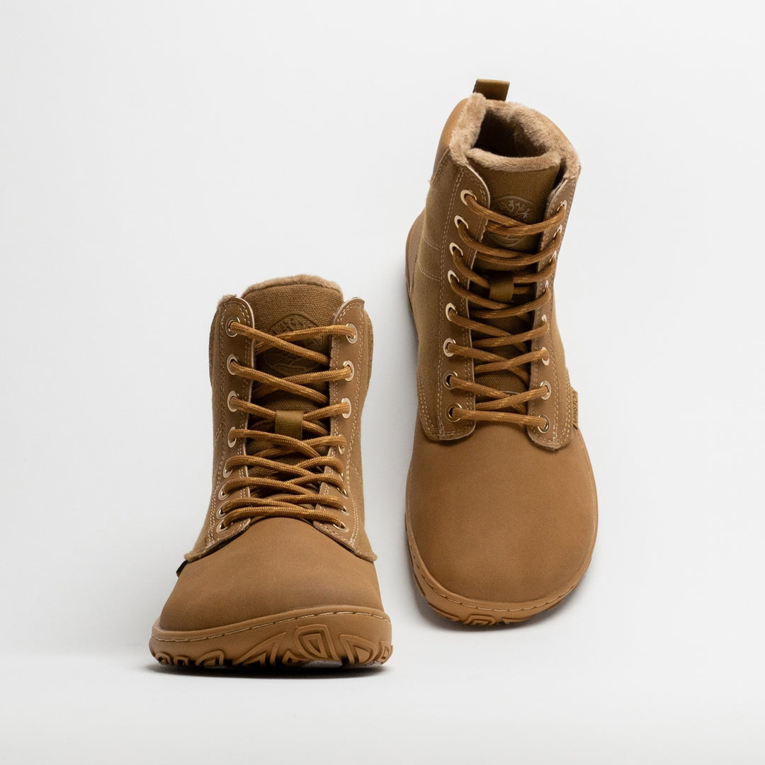 Vaistoa Hurmos 3 casual winter barefoot boots – pair with the left shoe shown from the front and the right shoe from a rear angle, showing the heel, pull tab and faux fur lining at the collar