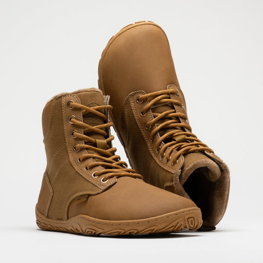 Vaistoa Hurmos 3 casual winter barefoot boots – pair with the front shoe at a front angle and the second shoe upside down behind it, showing the faux fur lining at the shaft opening