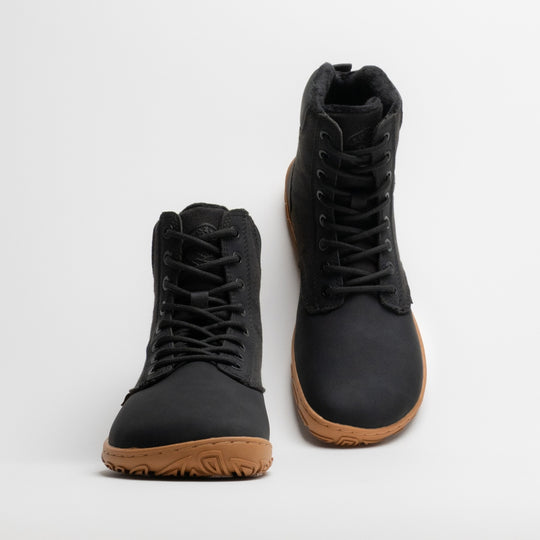 Vaistoa Hurmos 3 casual winter barefoot boots – pair with the left shoe shown from the front and the right shoe from a rear angle, showing the heel, pull tab and faux fur lining at the collar