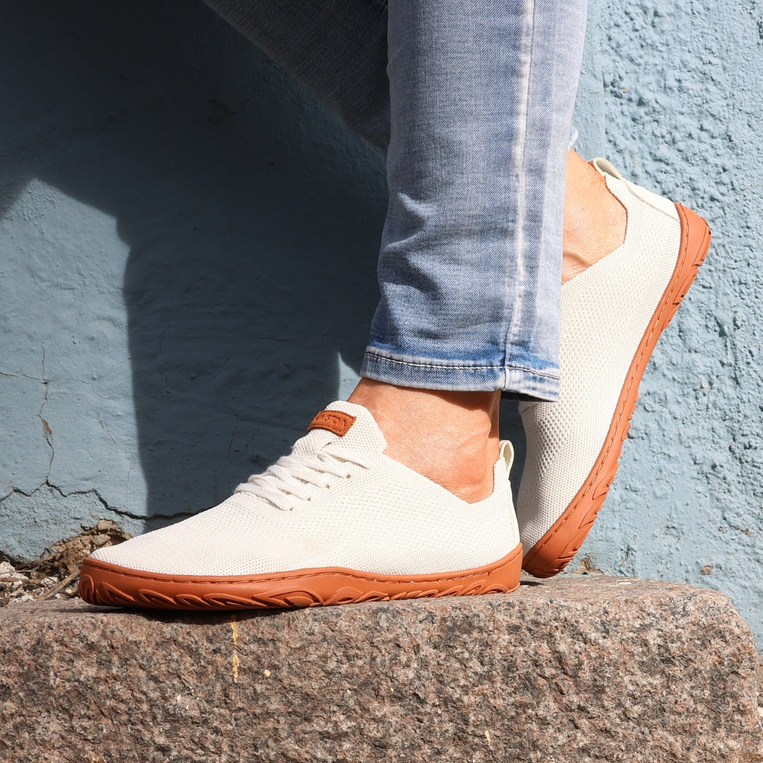 vaistoa iloa barefoot shoes knitted sneakers natural white with terracotta sole spring lifestyle blue wall