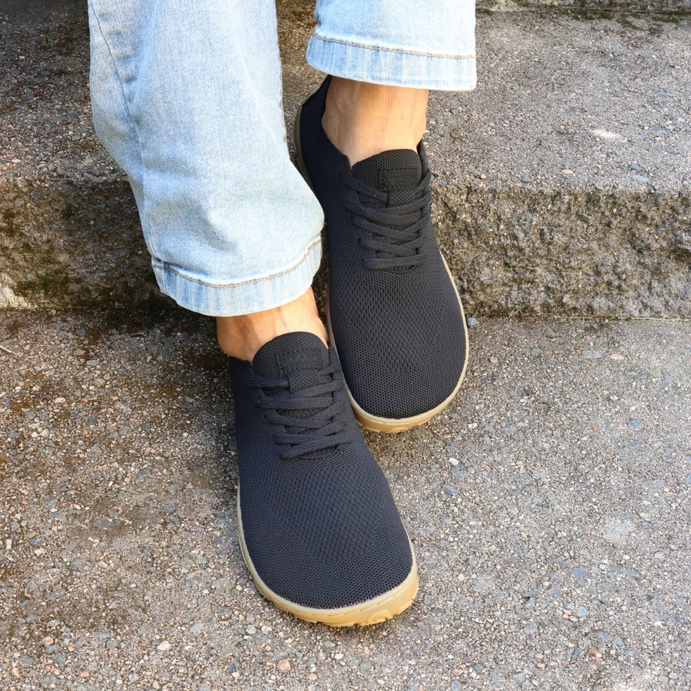 Vaistoa Iloa knitted barefoot sneakers – shoes worn on foot on stone steps, shown from the front