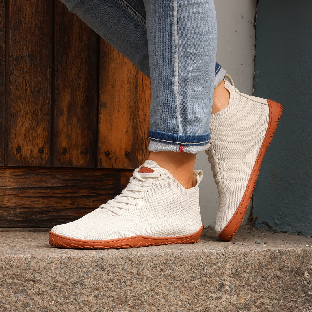 vaistoa iloa mid barefoot shoes knitted high top sneakers natural white terracotta lifestyle spring step on stairs