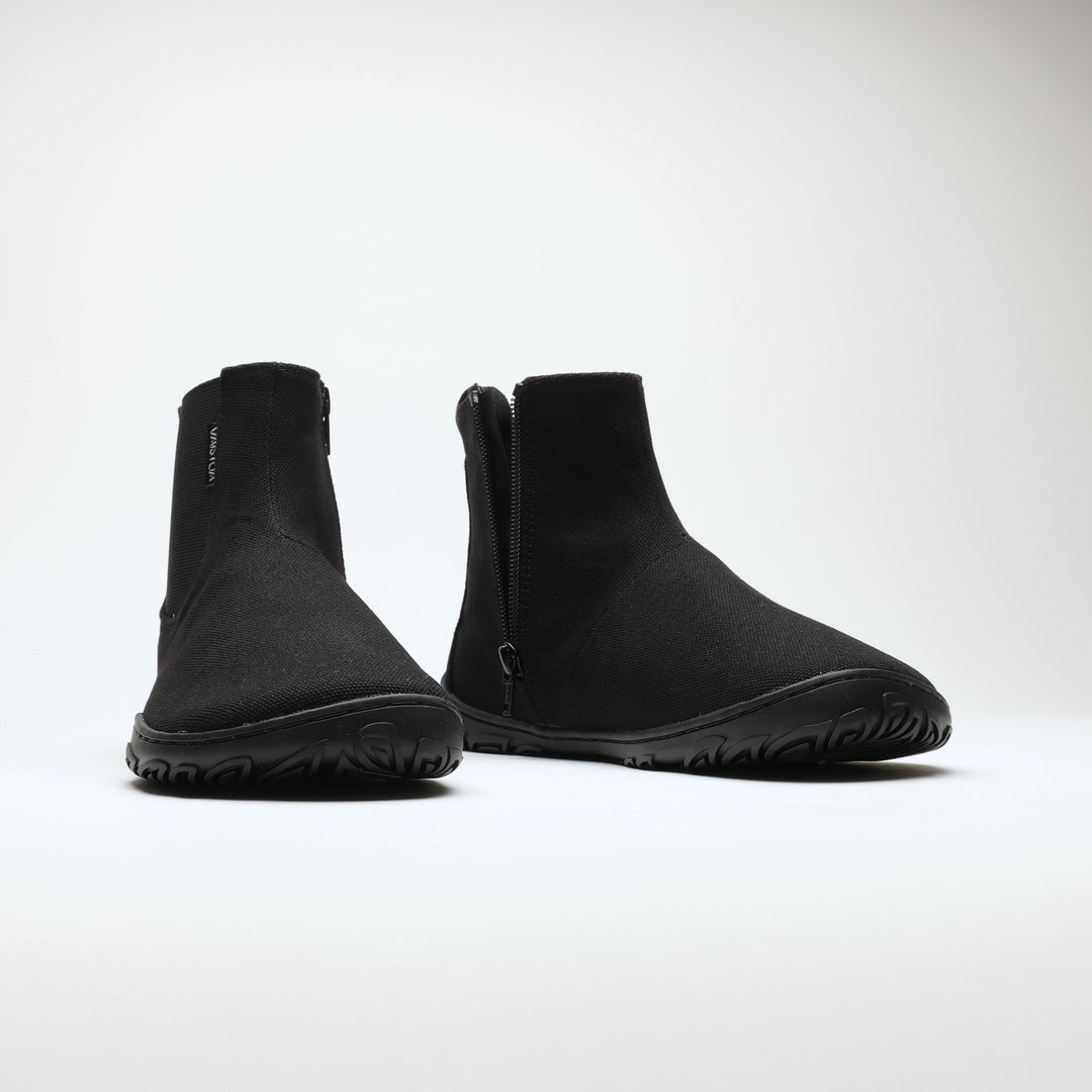 Vaistoa Kajo 2 barefoot chelsea boots – classic black pair shown from the front side by side, both side zippers visible against a light background