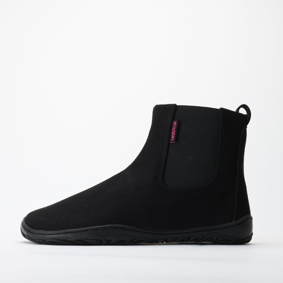 Vaistoa Kajo barefoot Chelsea boots – black, single boot in side profile, elastic side panel and the flat thin sole visible, light background