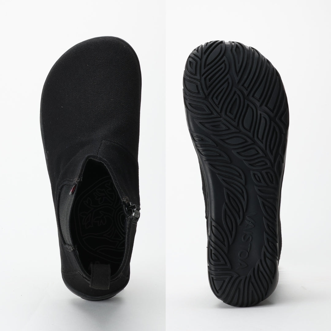 Vaistoa Kajo barefoot Chelsea boots – black, two studio views side by side, the boot from above showing the zipper and the interior, and the full outsole with its leaf tread pattern