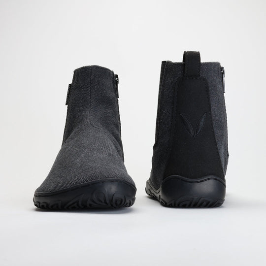 Vaistoa Kajo barefoot Chelsea boots – smoky stonewashed grey, studio shot of the pair, one boot from the front and the other from behind, zipper and heel loop visible