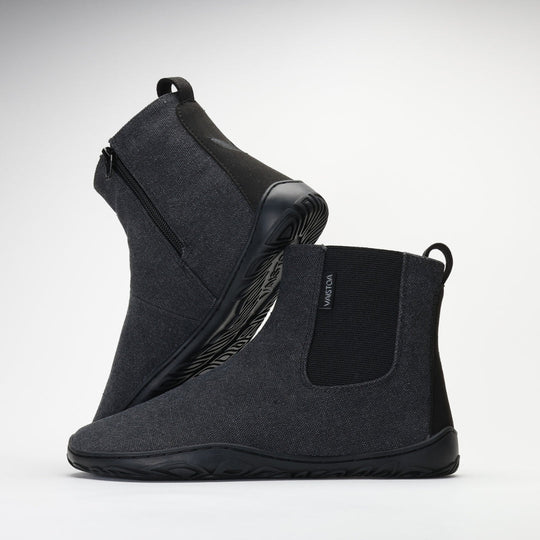 Vaistoa Kajo barefoot Chelsea boots – smoky stonewashed grey, studio shot of the pair, the back boot tilted so the outsole shows and the front boot side-on with the elastic panel and heel loop visible, light background