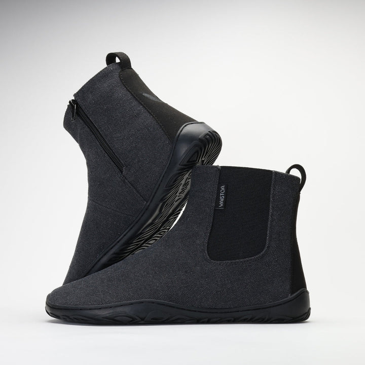 Vaistoa Kajo barefoot Chelsea boots – smoky stonewashed grey, studio shot of the pair, the back boot tilted so the outsole shows and the front boot side-on with the elastic panel and heel loop visible, light background