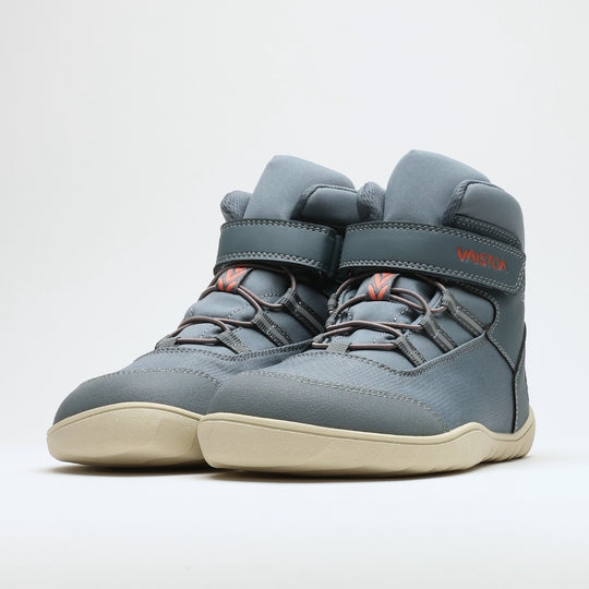 Vaistoa Kaste waterproof barefoot shoes for kids blue grey – the pair side by side seen from a front three-quarter angle, with the Vaistoa name on the hook-and-loop strap and an orange accent on the pull loop