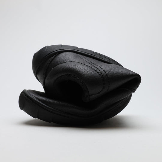 Vaistoa Katu 2 black barefoot sneakers – rolled up tightly, showcasing the thin and highly flexible sole that allows natural movement.