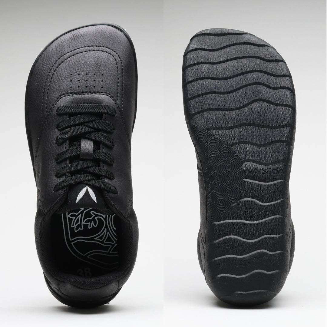 Vaistoa Katu 2 black barefoot sneakers – top view showing a wide, foot-shaped toe box, and sole view showing a thin, flexible sole with a wavy pattern.
