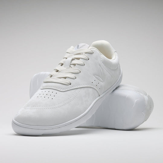 Vaistoa Katu 2 white barefoot sneakers – stylishly arranged so that one shoe leans against the sole of the other, highlighting the minimalist design and flexibility of the thin sole.