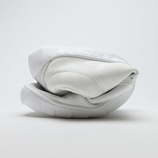 Vaistoa Katu 2 white barefoot sneakers – rolled up tightly, showcasing the thin and highly flexible sole that allows natural movement.