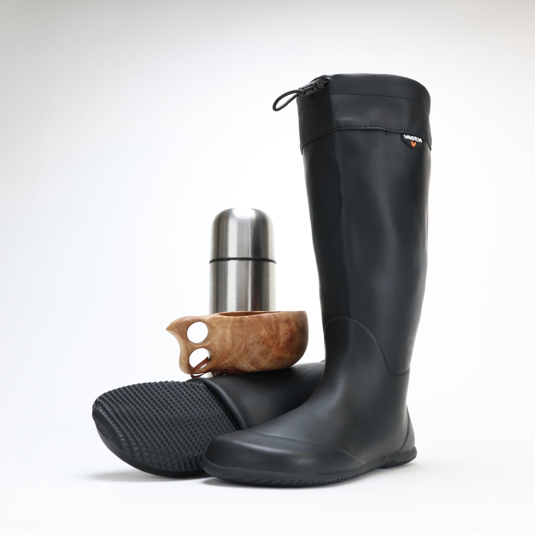 vaistoa katve barefoot shoes rubber rain boots black front angle one boot rolled kuksa thermos silver