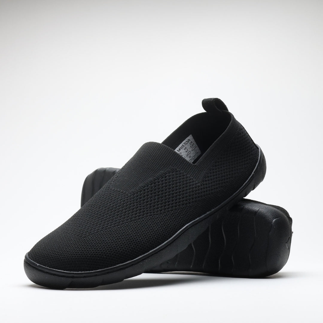 Black Vaistoa Lempeä 3 slip-on barefoot shoes shown as a pair in angled view with outsole visible