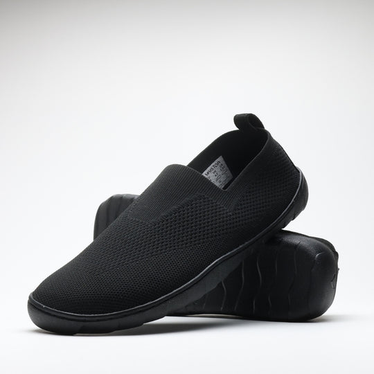 Black Vaistoa Lempeä 3 slip-on barefoot shoes shown as a pair in angled view with outsole visible