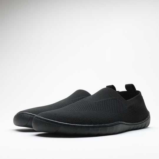 Black Vaistoa Lempeä 3 slip-on barefoot shoes shown as a pair from an angled side view