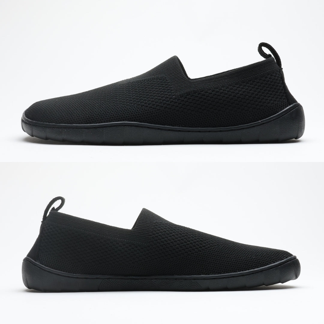 Black Vaistoa Lempeä 3 slip-on barefoot shoes shown as a pair from side profile highlighting flat zero-drop sole