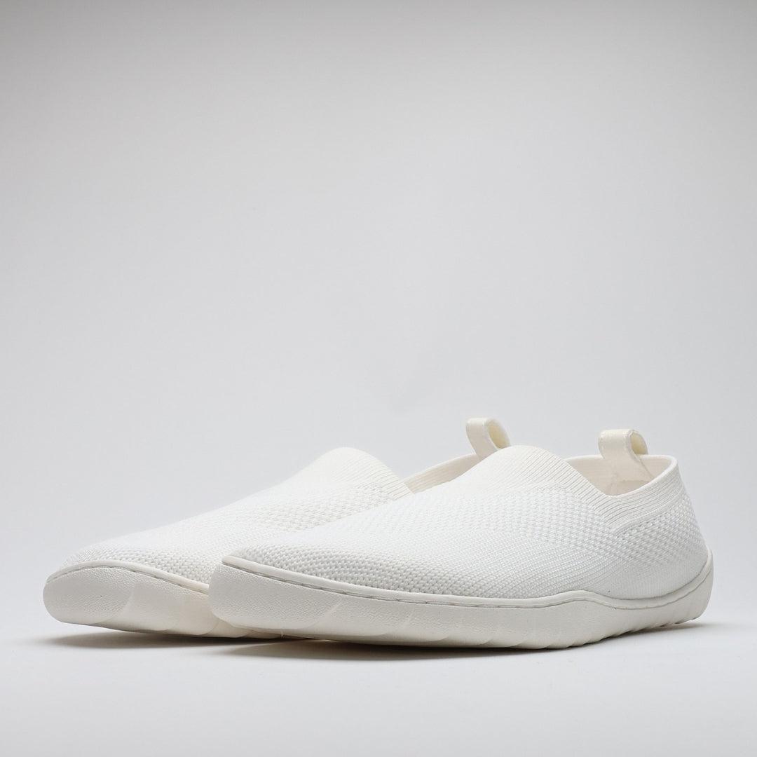 White Vaistoa Lempeä 3 slip-on barefoot shoes shown as a pair in angled side view