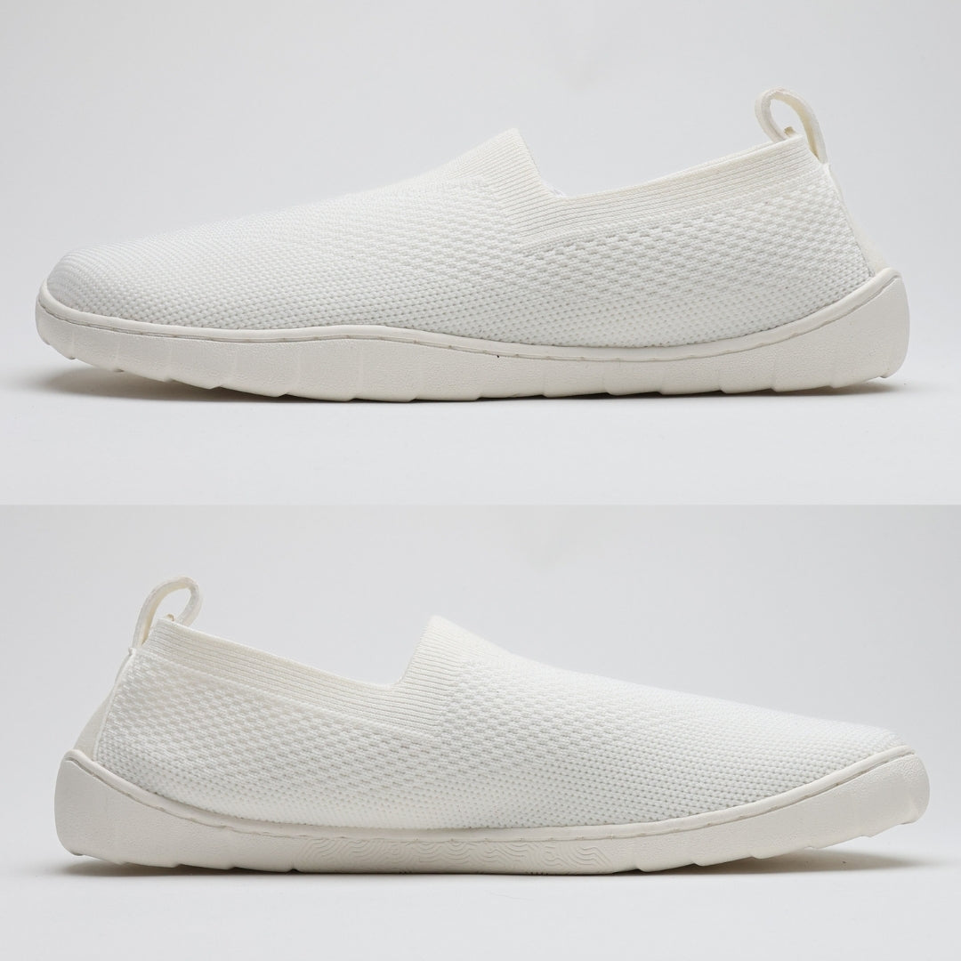 White Vaistoa Lempeä 3 slip-on barefoot shoes shown as a pair from side profile highlighting flat zero-drop sole