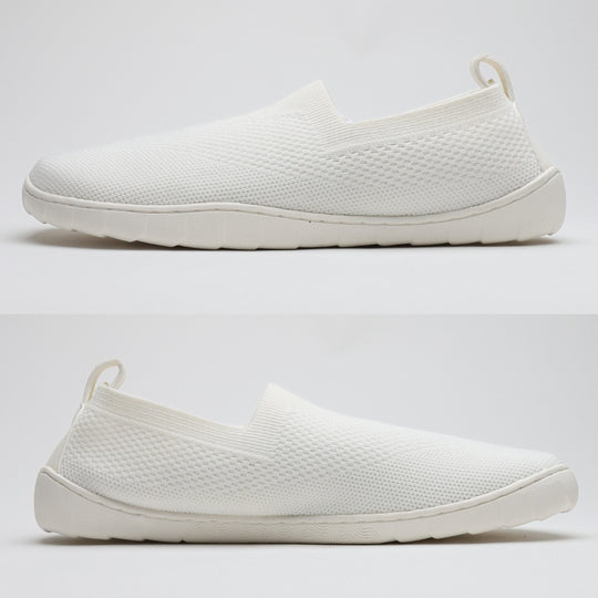 White Vaistoa Lempeä 3 slip-on barefoot shoes shown as a pair from side profile highlighting flat zero-drop sole