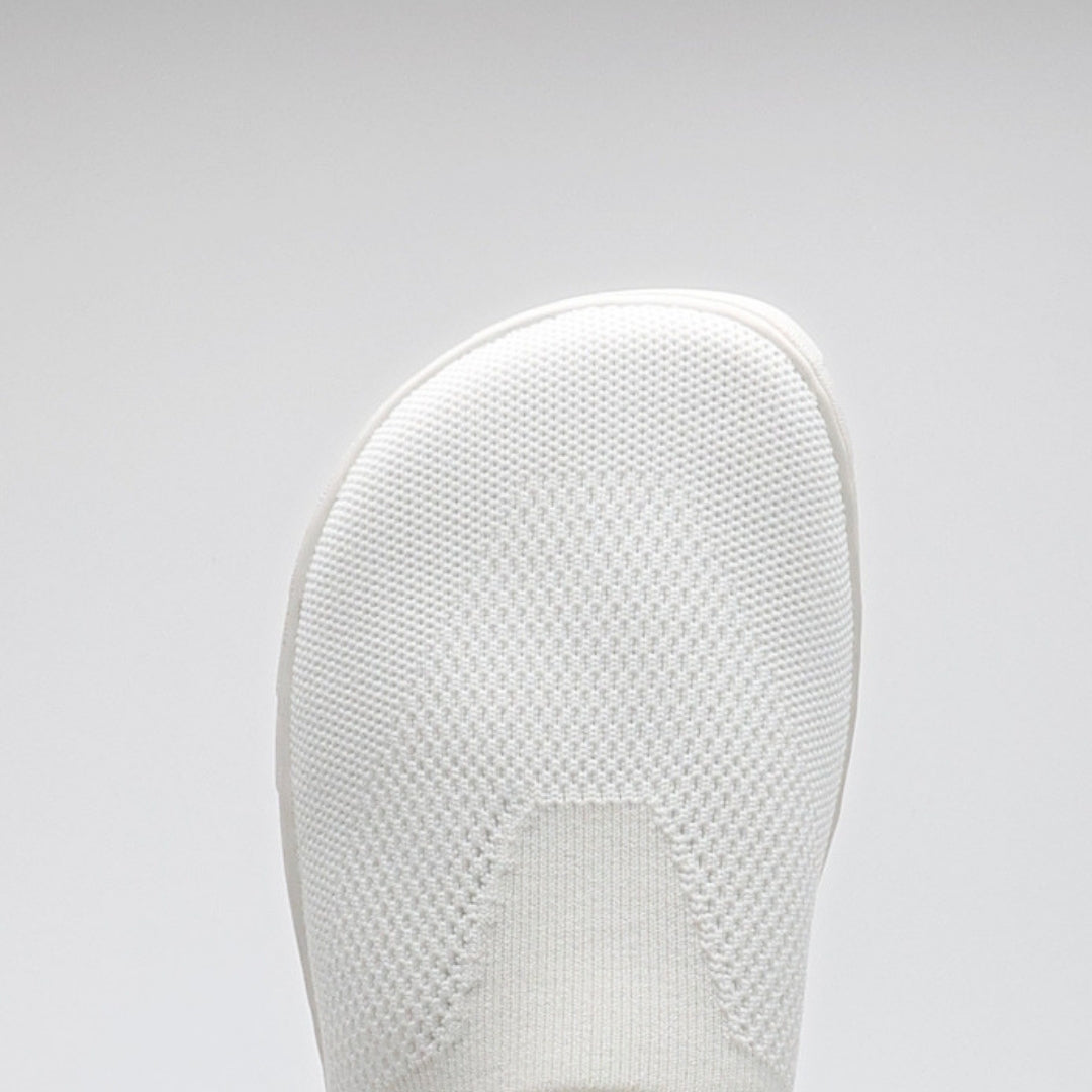 Vaistoa Lempeä 3 slip-on barefoot shoes – close-up of the white knit upper showing a wide, foot-shaped toe box