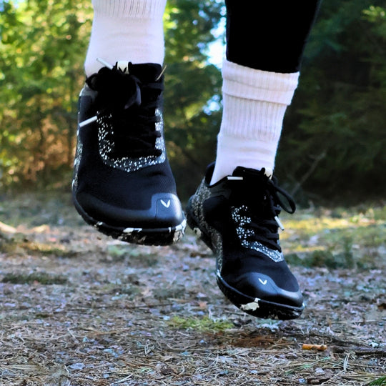Vaistoa Lento barefoot running shoes – shoes worn on a forest path, shown from the front during movement