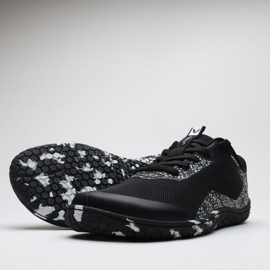 Vaistoa Lento barefoot running shoes – one shoe with the outsole facing forward, showing the tread pattern