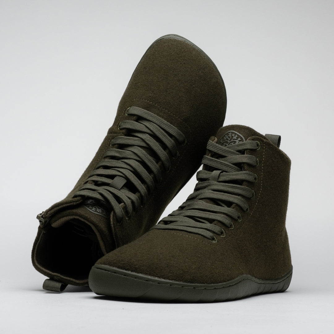 Vaistoa Tunto 2 felt barefoot sneakers – pair shown from the front angle, one shoe tipped over so its outsole and inner side are partially visible, olive colour
