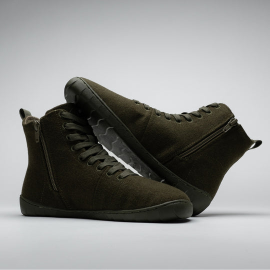 Vaistoa Tunto 2 felt barefoot sneakers – pair shown in a crossed, dynamic arrangement, the wave-pattern outsole of one shoe visible from the side, olive colour