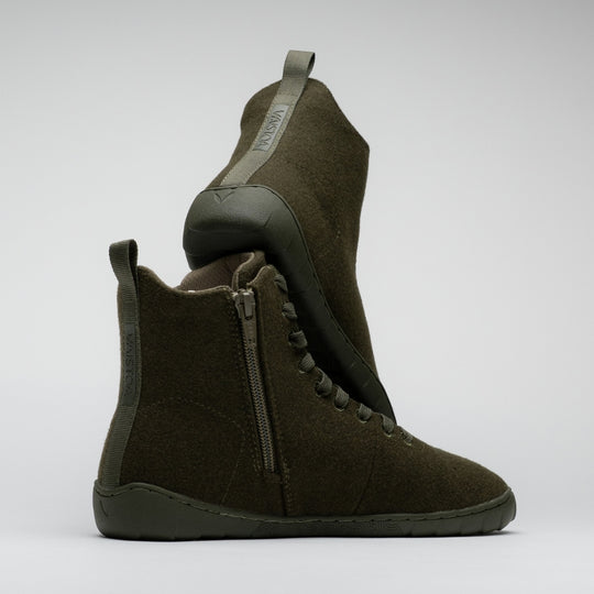 Vaistoa Tunto 2 felt barefoot sneakers – pair shown side-on, stacked one on top of the other, the vertical 'Vaistoa' text on the heel-pull tab visible, olive colour