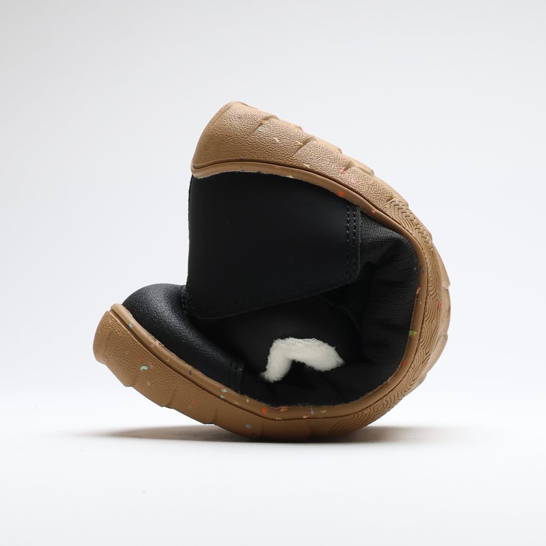 Vaistoa Ulappa 2 Kids waterproof barefoot sneakers – shoe rolled up, showing how the thin, flexible outsole bends