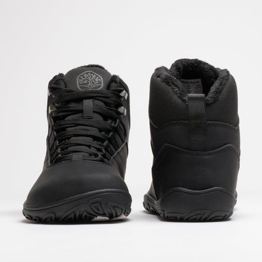 Vaistoa Uoma 4 winter barefoot trekking boots – pair shown from the front and back, the left shoe showing the wide toe box and lacing and the right shoe the heel, pull tab and faux fur lining