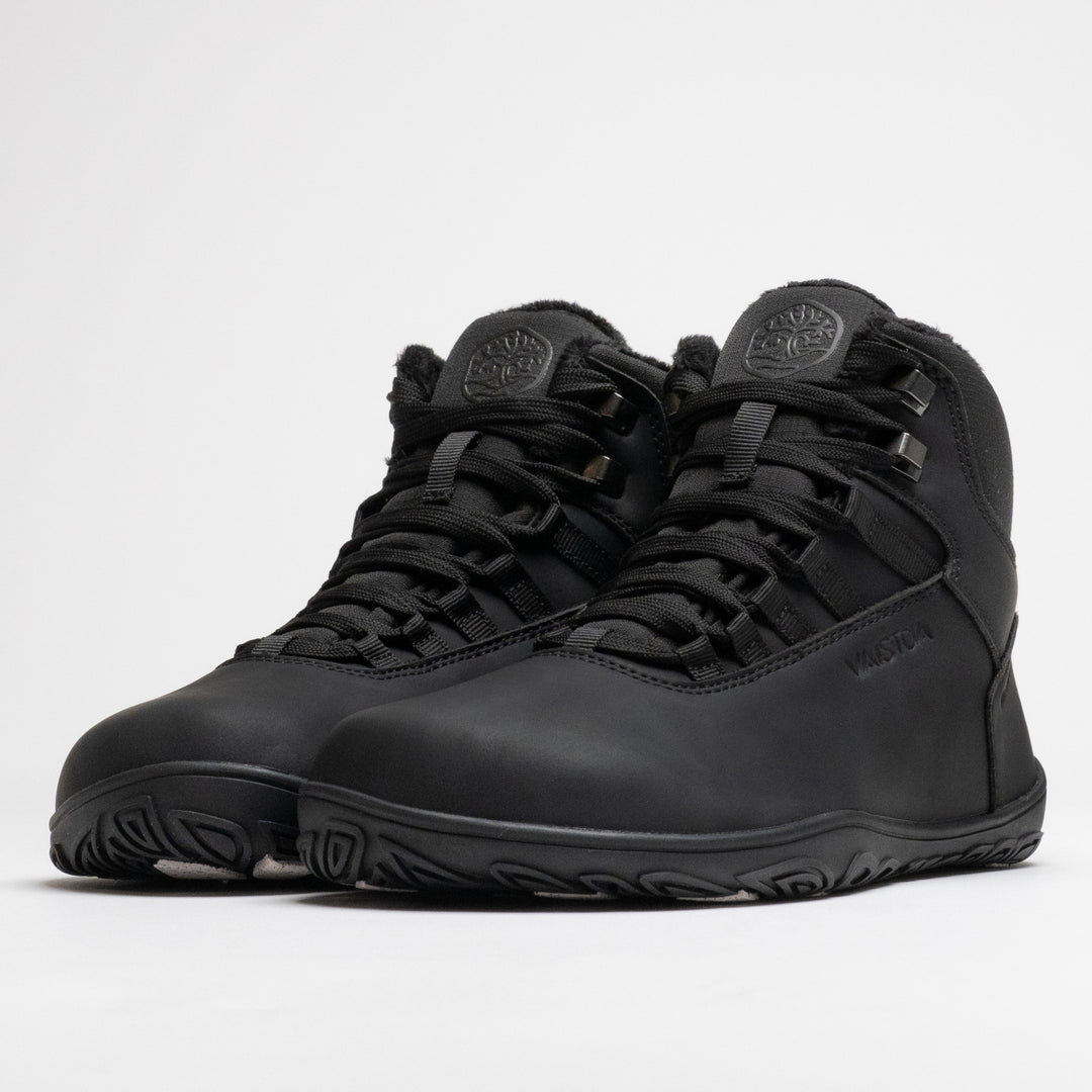 Vaistoa Uoma 4 winter barefoot trekking boots – pair shown from a front angle with the lacing and metal lace hooks visible