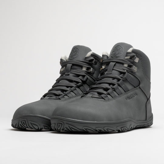 Vaistoa Uoma 4 winter barefoot trekking boots – pair shown from a front angle with the lacing and metal lace hooks visible