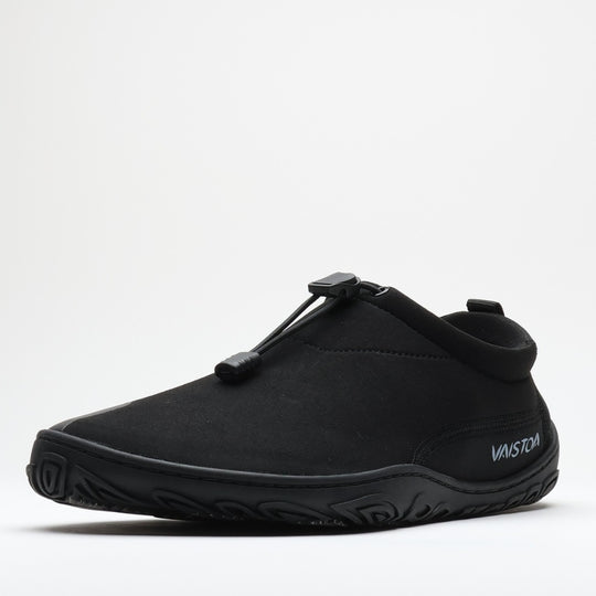 Black Vaistoa Vire barefoot shoe shown from the side profile against a light background. The low-profile design, flexible upper, and thin outsole are clearly visible.
